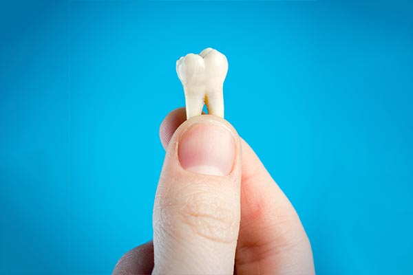 A General Dentist Helps You Decide Whether To Pull or Save a Tooth from Queens Family Dental in Flushing, NY