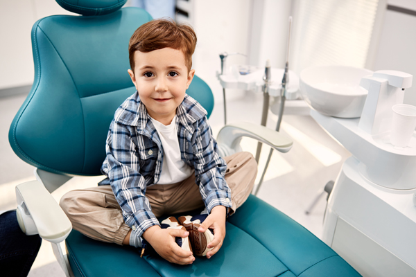Should I Take My Child To A Kid Friendly Dentist In Flushing For White Spots On Teeth?